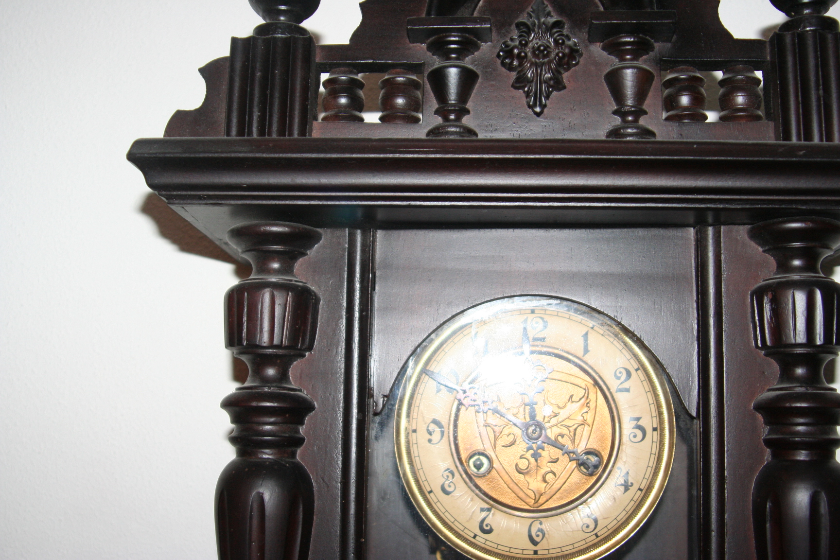 Old wall clock with pendulum